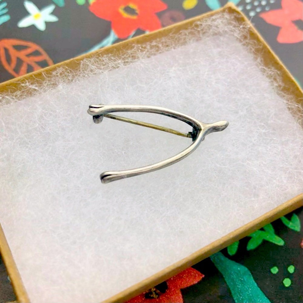 Antique wishbone pin with lifelike detailing